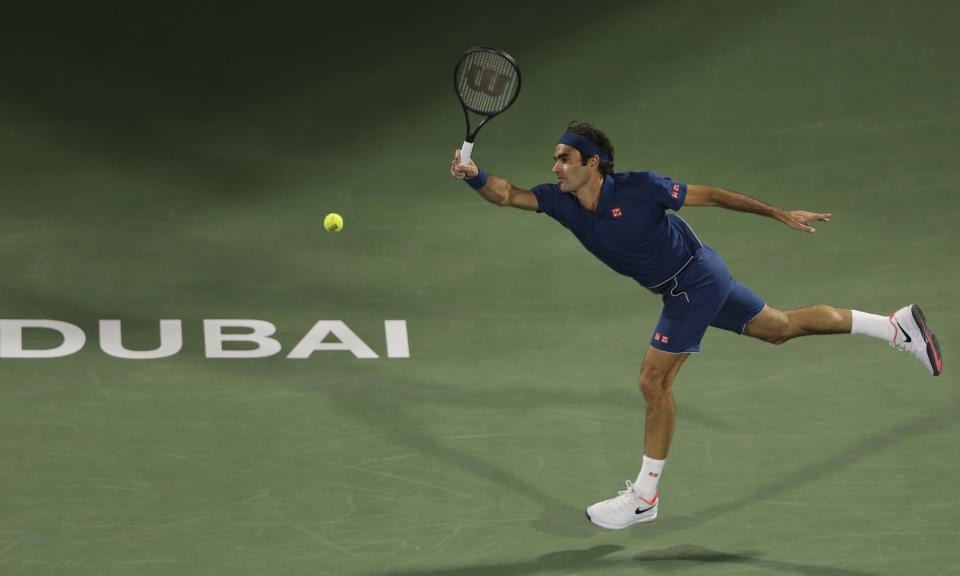 Roger Federer of Switzerland returns the ball to Stefanos Tsitsipas of Greece during their final match at the Dubai Duty Free Tennis Championship, in Dubai, United Arab Emirates, Saturday, March 2, 2019. (AP Photo/Kamran Jebreili)