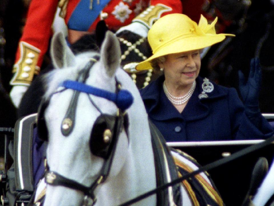 Queen Elizabeth wearing a yellow hat to Trooping the Colour in 1994