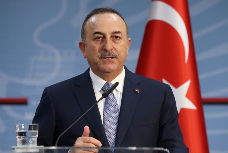 Turkish Foreign Minister Cavusoglu speaks during a news conference in Tirana