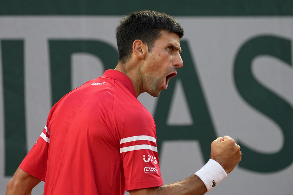 Serbia's Novak Djokovic celebrates a winning point as he plays Spain's Rafael Nadal during their semifinal match of the French Open tennis tournament at the Roland Garros stadium Friday, June 11, 2021 in Paris. (AP Photo/Michel Euler)