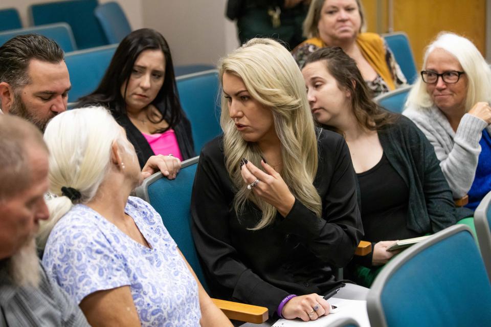 Family members of Amy Scott discuss things during a break in the Christopher Alan Smith trial Wednesday October 11, 2023. Smith is charged with second degree murder and aggravated battery with a deadly weapon. He's accused of killing Amy Scott. The trial was being held in Judge Peter Bringham’s courtroom at the Marion County Judicial Center in Ocala, Fla. [Doug Engle/Ocala Star Banner]2023