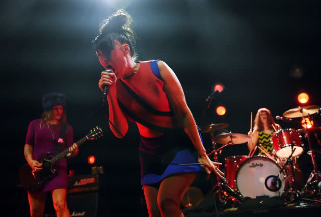 Kathleen Hanna of the punk rock band Bikini Kill performs alongside bandmates Erica Dawn Lyle (left) and Tobi Vail at Los Angeles' Hollywood Palladium in May 2019. (Photo: Chris Pizzello/Invision via Associated Press)