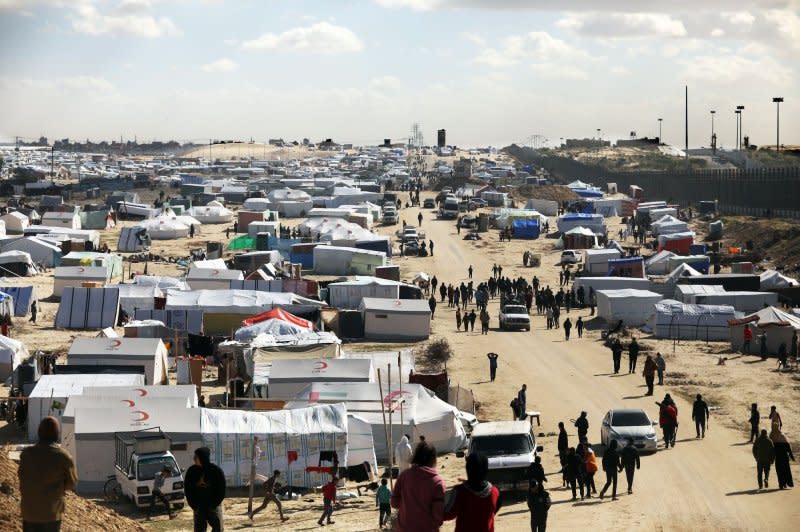 A tent camp shelters refugees who have fled fighting between Israeli and Palestinian forces in Rafah in the southern Gaza Strip on Thursday. Photo by Ismael Mohamad/UPI