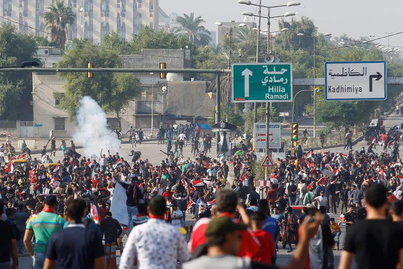 Demonstrators gather during a protest over corruption, lack of jobs, and poor services, in Baghdad