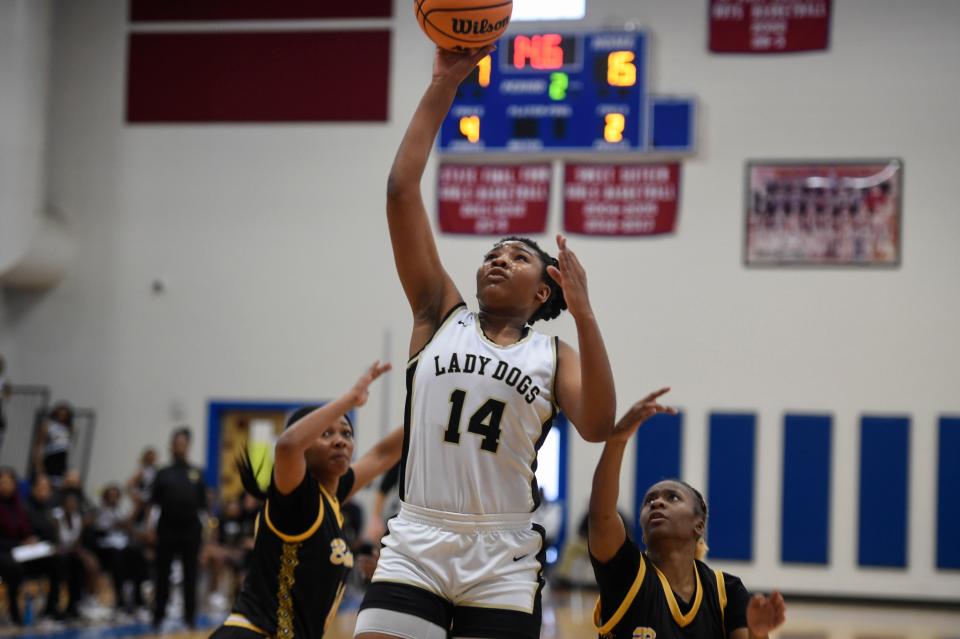 Thomson point guard Jada Kendrick (14) shoots the ball during the Thomson and Butler Region 4 AA semifinal basketball game at Westside high school on Thursday, Feb. 16, 2023. Thomson defeated Butler 36-29 and will continue on in the region playoffs. 