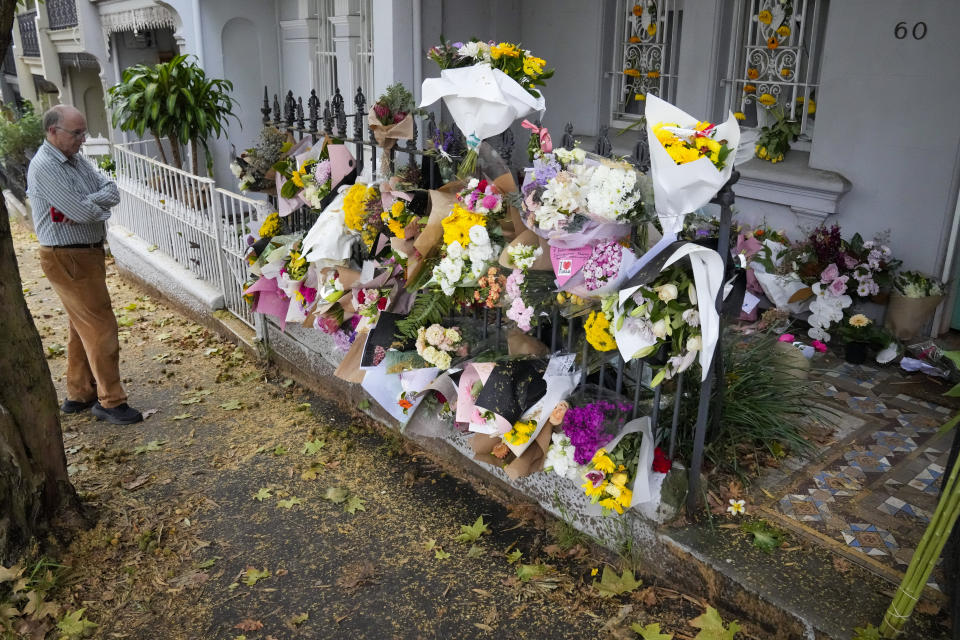 A man stands outside the Paddington residence of Jesse Baird in Sydney, Tuesday, Feb. 27, 2024. Police on Tuesday discovered the bodies of former television reporter Jesse Baird, 26, and his flight attendant partner Luke Davies, 29, who were allegedly shot dead in Baird's Sydney home on Monday last week. (AP Photo/Mark Baker)