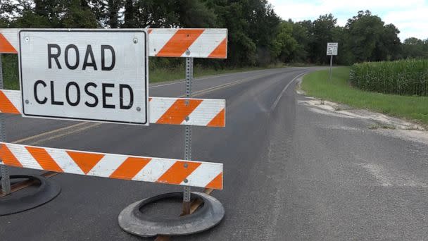 PHOTO: A road closed sign cuts off traffic from an area where two cyclists were killed after being struck by a car in Ronald Township, Mich., during a Make-A-Wish event, July 30, 2022.  (WZZM)