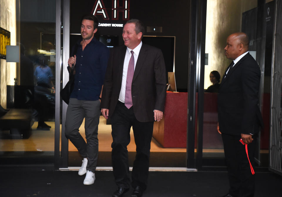 Sports Direct CEO Mike Ashley leaving its headquarters in London with his future son-in-law Michael Murray
