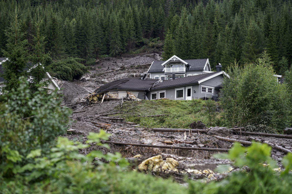 An mudslide has hit several residential buildings in Bagn in Valdres, Norway, Tuesday, Aug. 8, 2023. Officials in northern Europe are warning people to stay inside as stormy weather batters the region. Storm Hans has cancelled ferries, delayed flights, flooded streets and injured people. Norwegian authorities expected “extremely heavy rainfall” on Tuesday. (Cornelius Poppe/NTB Scanpix via AP)
