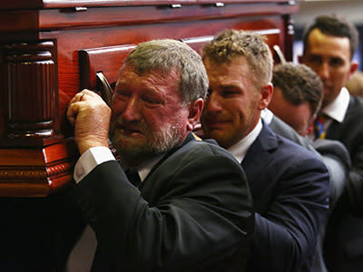 A devastated Gregory Hughes and Aaron Finch acting as pallbearers.