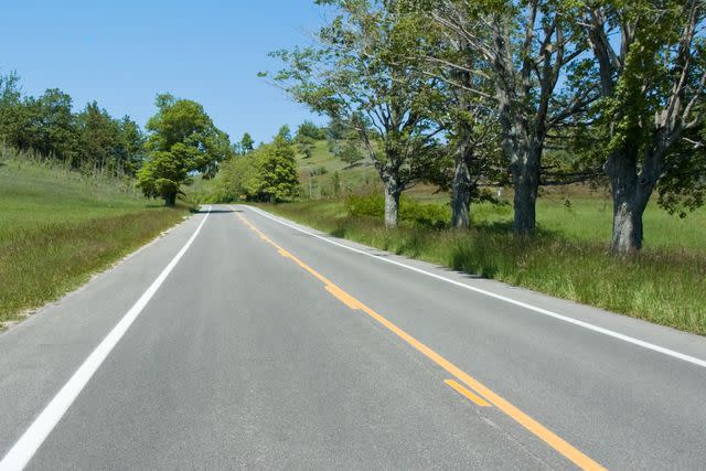 <p>Getty</p> Stock image of an empty road
