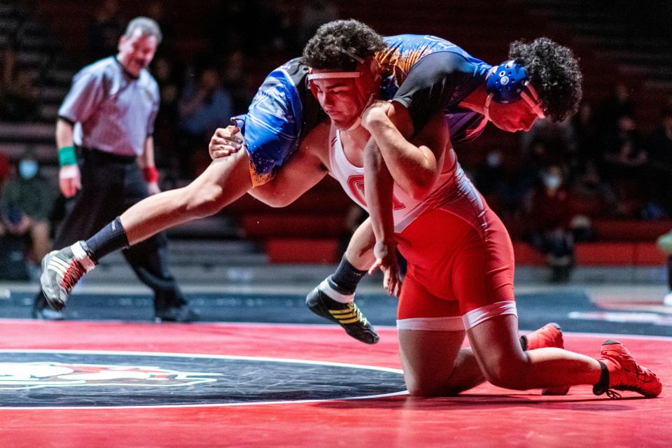 Oak Hills' Jacob Hernandez takes down Serrano's Richard Araujo during their 195-pound match on Thursday, Jan. 20, 2022. Araujo won the match and Oak Hills claimed the Mojave River League wrestling title.