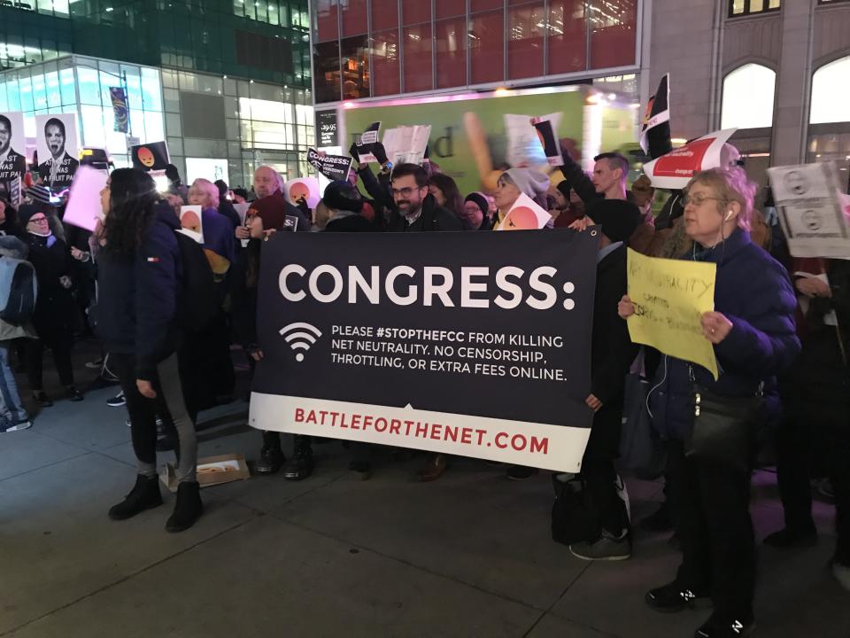 Net neutrality supporters gather at a rally in front of a Verizon store on 42nd Street in New York City on Dec. 7. (Photo: Jenna Amatulli)