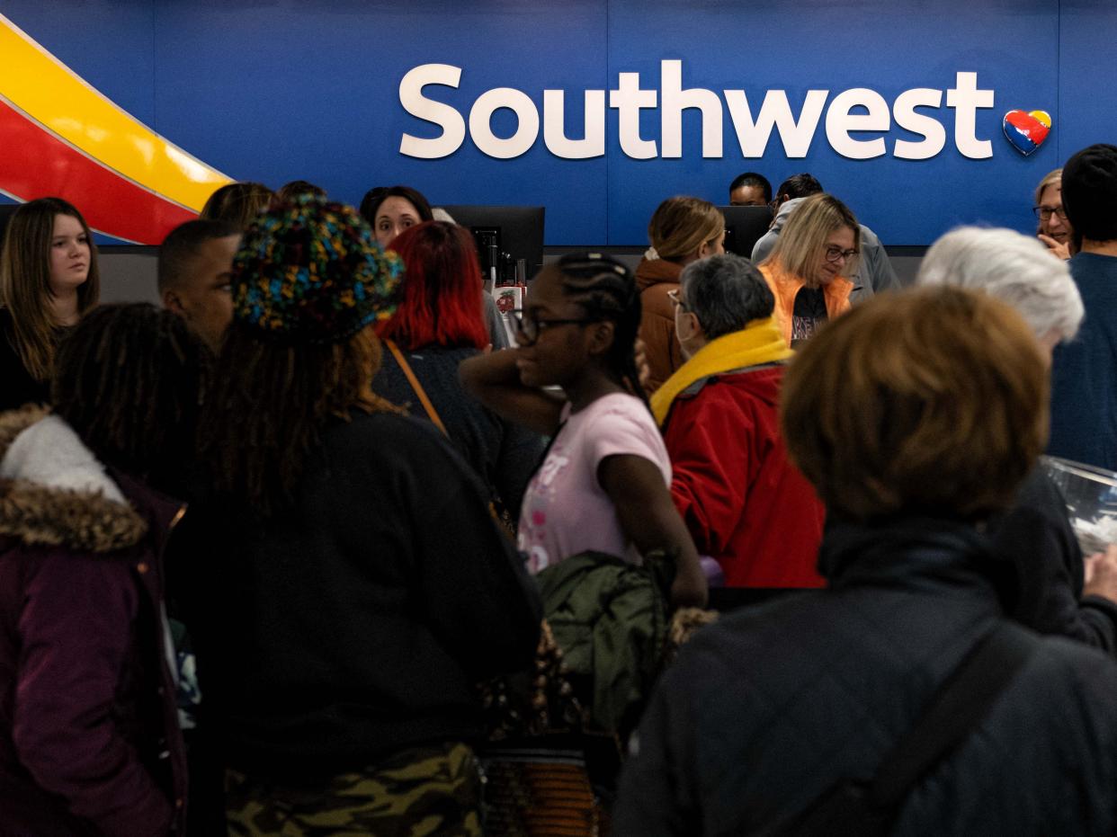 Travellers wait in line at the Southwest Airlines ticketing counter at Nashville International Airport