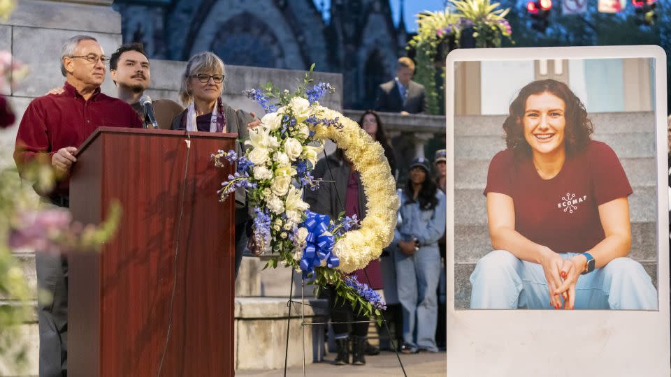 Pava LaPere's father, Frank LaPere, is joined by his wife Caroline and son Nico as he speaks during a vigil on Wednesday. - Stephanie Scarbrough/AP