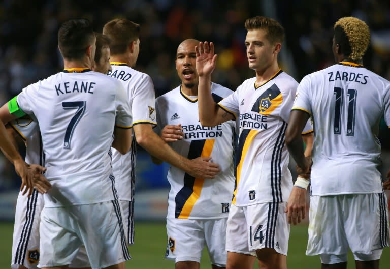 Robbie Keane, Mike Magee, Steven Gerrard, Nigel de Jong, Robbie Rogers and Gyasi Zerdes of Los Angeles Galaxy celebrate after scoring a goal against D.C. United, at StubHub Center in Carson, California, on March 6, 2016