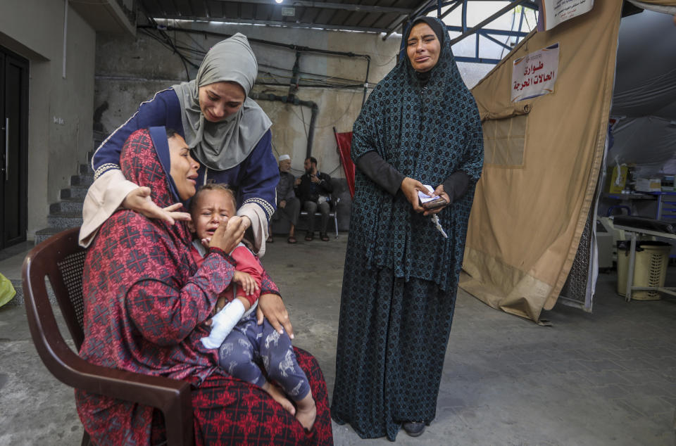 Palestinians mourn their relatives killed in the Israeli bombardment of the Gaza Strip, at a hospital in Rafah, Gaza, Friday, May 10, 2024. (AP Photo/Ismael Abu Dayyah)