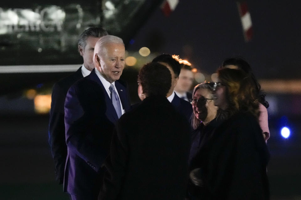 President Joe Biden shakes hands with Los Angeles Mayor Karen Bass, center, as he arrives at Santa Monica Airport in Santa Monica, Calif., Friday, Dec. 8, 2023. (AP Photo/Manuel Balce Ceneta)