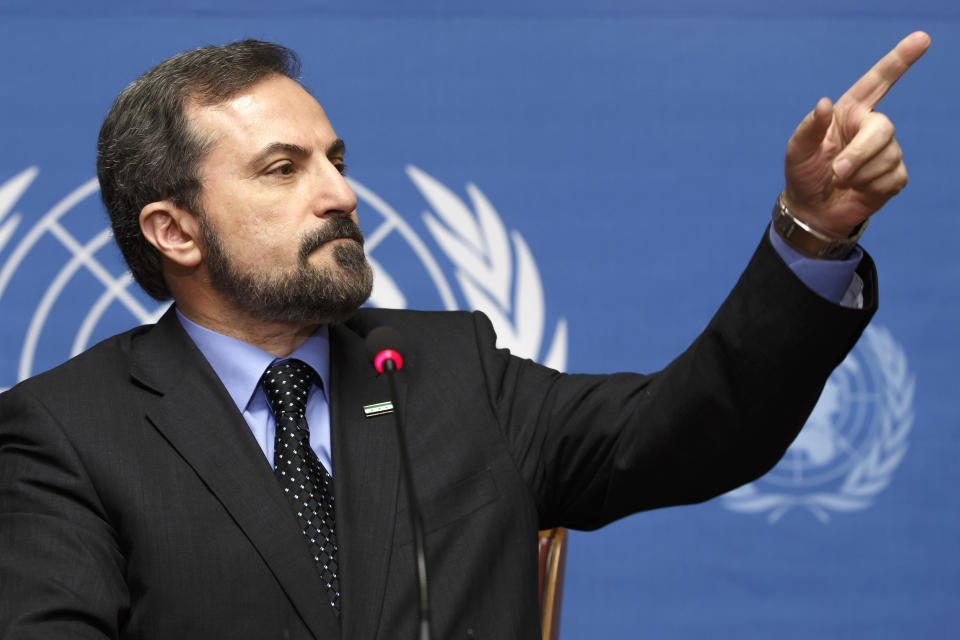 Louay Safi, spokesperson for the Syrian National Coalition, speaks to the media during a news conference after the second round of negotiations between the Syrian government and the opposition at the European headquarters of the United Nations, in Geneva, Switzerland, Friday, Feb. 14, 2014. (AP Photo/Keystone, Salvatore Di Nolfi)