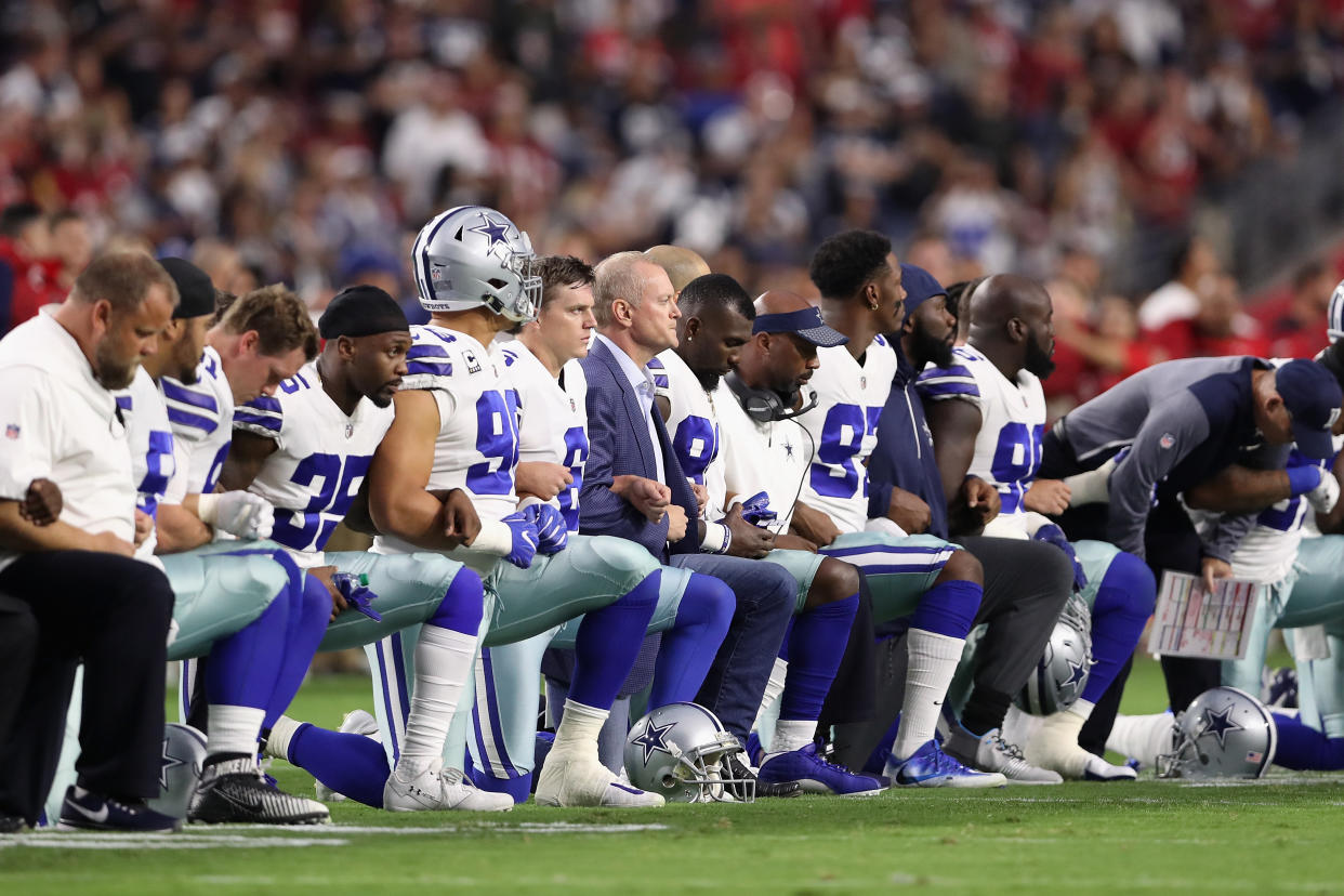 Members of the Dallas Cowboys kneel prior to a game in 2017. (Photo by Christian Petersen/Getty Images)