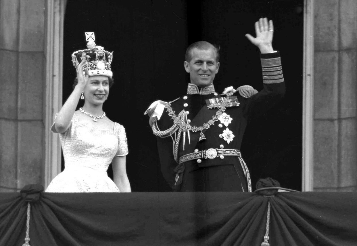 This is a June. 2, 1953  file photo of Britain's Queen Elizabeth II and Prince Philip, Duke of Edinburgh, as they wave to supporters from the balcony at Buckingham Palace, following her coronation at Westminster Abbey. London. 