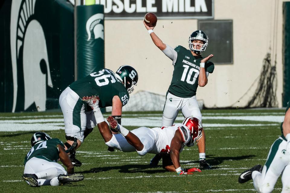 Payton Thorne passes against Indiana at Spartan Stadium on Nov. 14, 2020.