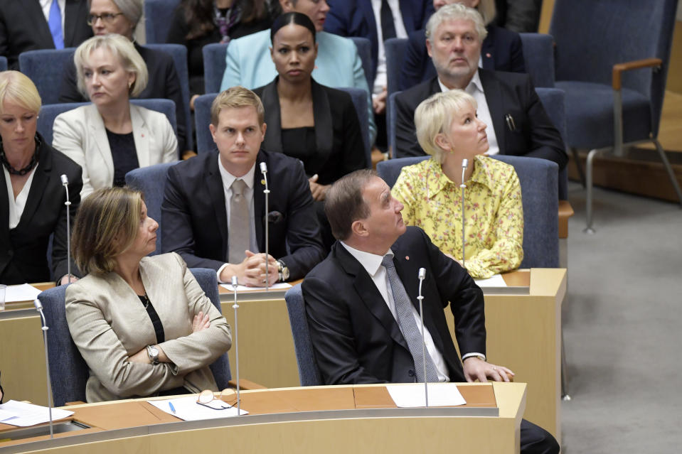 Swedish Prime Minister Stefan Lofven, right, attends parliament during a vote of confidence in the Swedish Parliament Riksdagen, Tuesday Sept. 25, 2018. The prime minister lost a vote of confidence in parliament, meaning he will have to step down. He will continue as caretaker prime minister until a new government can be formed. (Anders Wiklund/TT via AP)