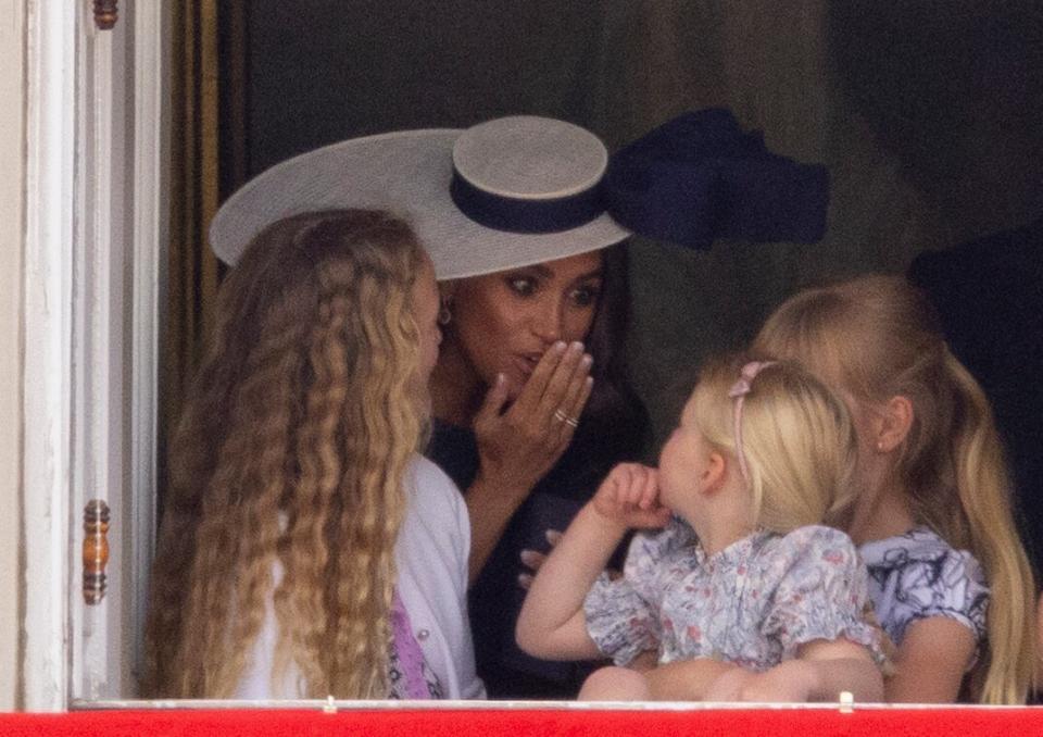 Meghan Markle with Savannah Phillips and Mia Tindall in the Major General's office overlooking The Trooping of the Colour on Horse Guards Parade.