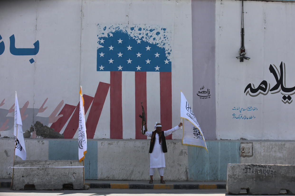 A member of the Afghan Taliban celebrates the third anniversary of the group's takeover of Afghanistan in front of the former U.S. Embassy compound in Kabul, Aug. 14, 2024. / Credit: Bilal Guler/Anadolu/Getty