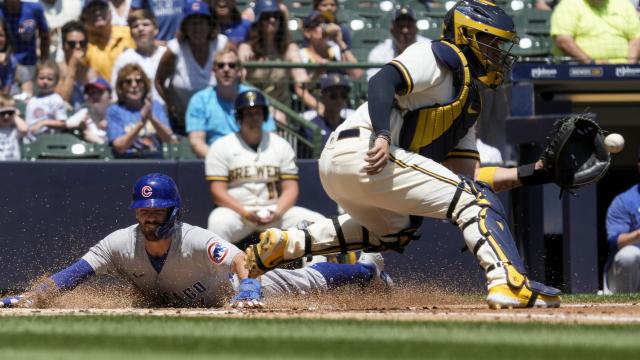 Shortstop Dansby Swanson of the Chicago Cubs poses for his first