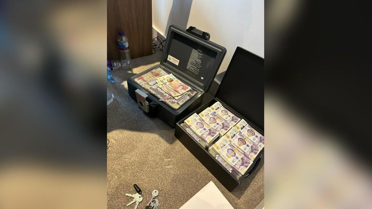 Cases containing £237k in cash recovered from Angus McBeath's apartment