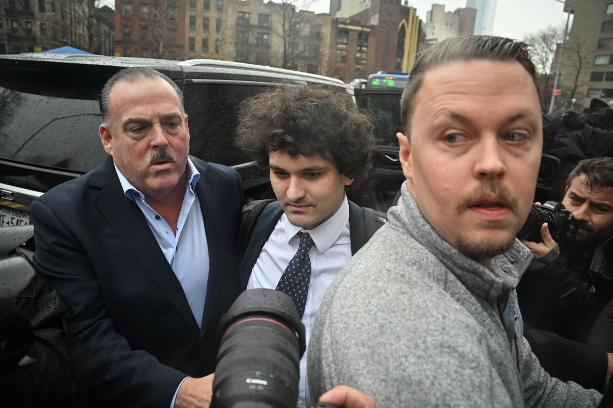 Former FTX chief executive Sam Bankman-Fried (C) arrives to enter a plea before US District Judge Lewis Kaplan in the Manhattan federal court, New York, January 3, 2023. - Bankman-Fried faces criminal fraud charges over the spectacular collapse of his crypto exchange. (Photo by Ed JONES / AFP) (Photo by ED JONES/AFP via Getty Images)