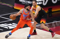 Utah Jazz forward Bojan Bogdanovic, right, guards Oklahoma City Thunder forward Kenrich Williams (34) during the first half of an NBA basketball game Tuesday, April 13, 2021, in Salt Lake City. (AP Photo/Rick Bowmer)