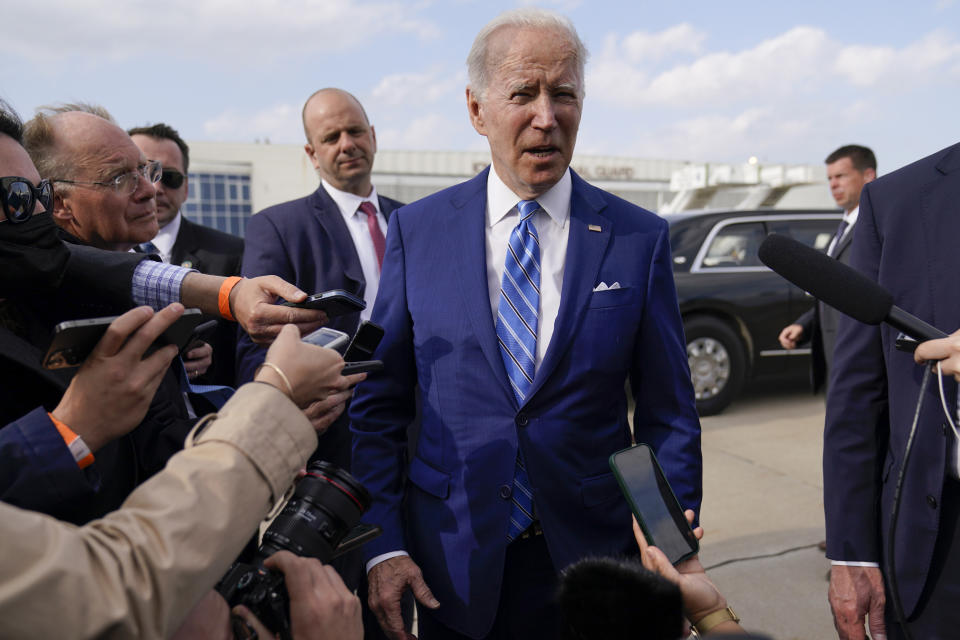 President Joe Biden speaks to reporters before boarding Air Force One at Des Moines International Airport, in Des Moines Iowa, Tuesday, April 12, 2022, en route to Washington. Biden said that Russia's war in Ukraine amounted to a "genocide," accusing President Vladimir Putin of trying to "wipe out the idea of even being a Ukrainian."(AP Photo/Carolyn Kaster)