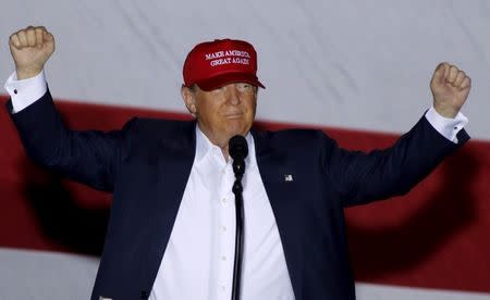 U.S. Republican presidential candidate Donald Trump reacts after being introduced at a campaign rally at the Sunset Cove Amphitheater in Boca Raton, Florida, March 13, 2016. REUTERS/Joe Skipper