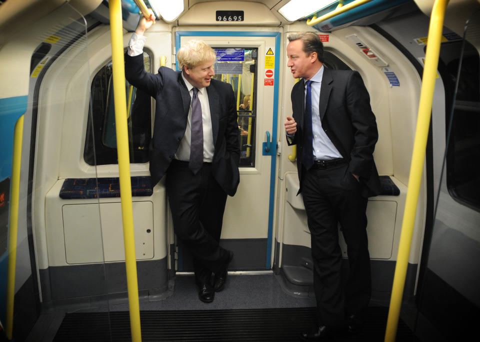 Prime Minister David Cameron and London Mayor Boris Johnson (left) take the tube from Westminster to Southwark where they visited Transport for London's Surface Transport and Traffic Operations Centre which monitors traffic flow and will play a key part in the summer during the London Olympics. PRESS ASSOCIATION Photo. Picture date: Saturday March 3, 2012. See PA story POLITICS Conservatives. Photo credit should read: Stefan Rousseau/PA Wire