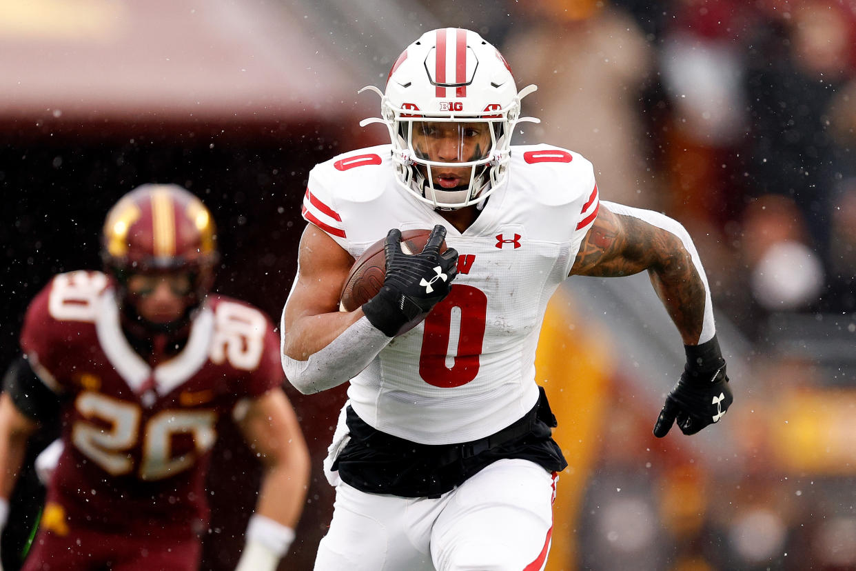 MINNEAPOLIS, MINNESOTA - NOVEMBER 25: Braelon Allen #0 of the Wisconsin Badgers runs with the ball against the Minnesota Golden Gophers in the first half at Huntington Bank Stadium on November 25, 2023 in Minneapolis, Minnesota. The Badgers defeated the Golden Gophers 28-14. (Photo by David Berding/Getty Images)