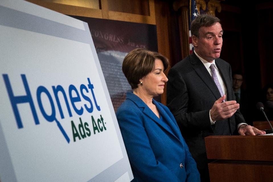 Senators Amy Klobuchar and Mark Warner introduced the “Honest Ads Act” to require online firms to disclose sources of political ads, aimed at curbing foreign interference in US elections (AFP Photo/Drew Angerer)
