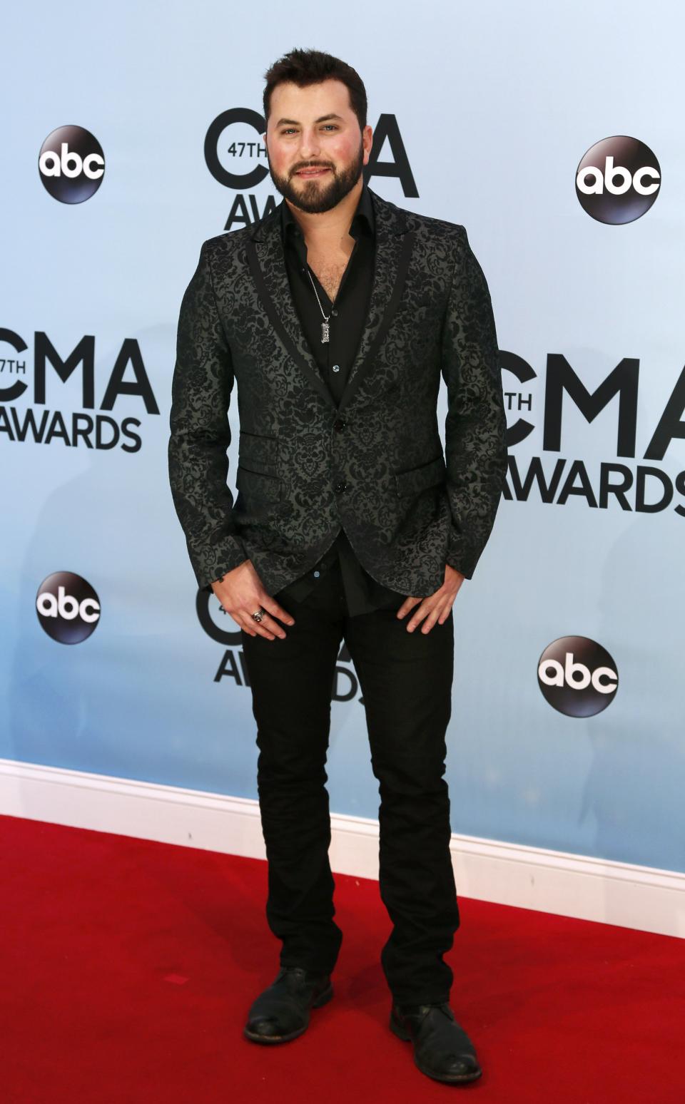 Tyler Farr poses on arrival at the 47th Country Music Association Awards in Nashville