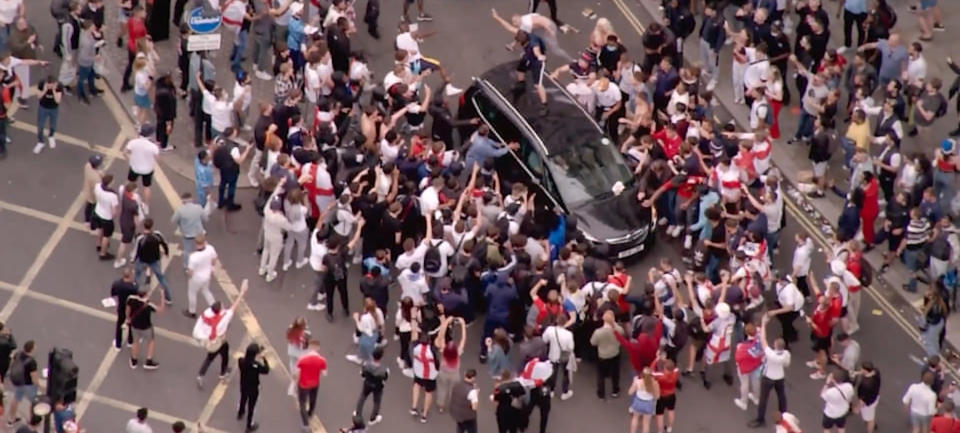 England fans swarming a car at the Euro 2020 final