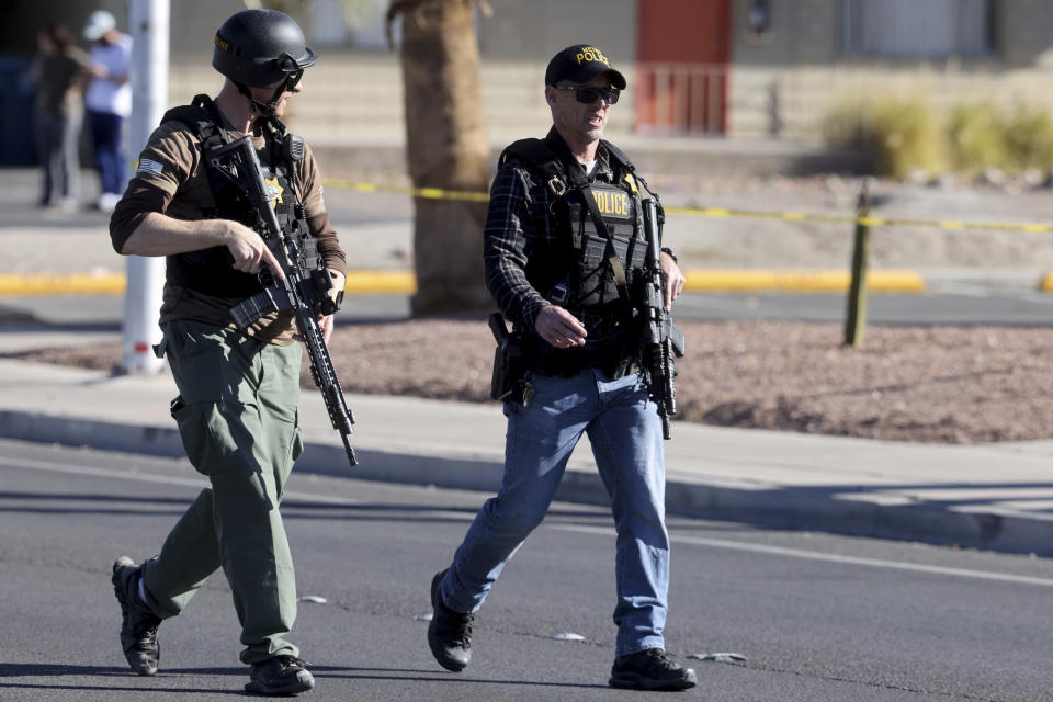 Police work the scene after a shooting on the University of Nevada, Las Vegas, campus in Las Vegas, Wednesday, Dec. 6, 2023. (K.M. Cannon/Las Vegas Review-Journal via AP)