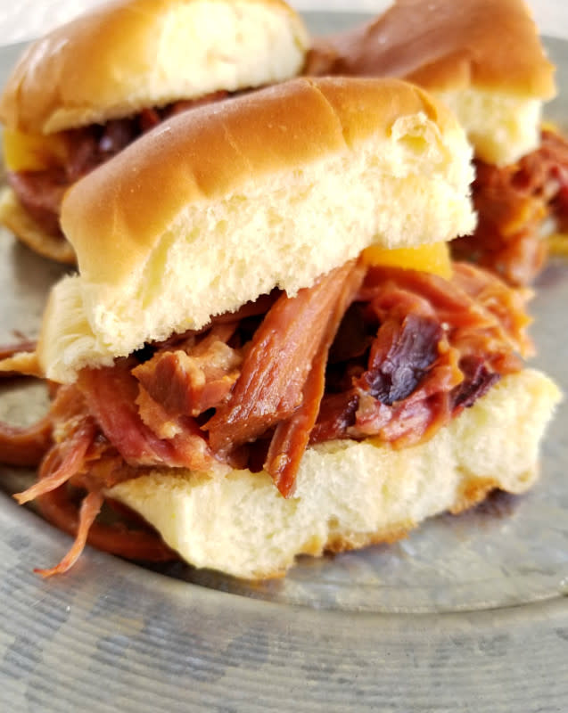 <p>South Your Mouth</p><p>Ham, brown sugar and pineapple make for one tasty little sandwich.</p><p><strong>Get the recipe: <a href="https://www.southyourmouth.com/2018/04/slow-cooker-hawaiian-ham.html" rel="nofollow noopener" target="_blank" data-ylk="slk:Slow Cooker Hawaiian Ham;elm:context_link;itc:0;sec:content-canvas" class="link ">Slow Cooker Hawaiian Ham</a></strong></p><p><strong>Related: <a href="https://parade.com/1054362/kristamarshall/fresh-pineapple-recipes/" rel="nofollow noopener" target="_blank" data-ylk="slk:30 Impressive Pineapple Recipes;elm:context_link;itc:0;sec:content-canvas" class="link ">30 Impressive Pineapple Recipes</a></strong></p>