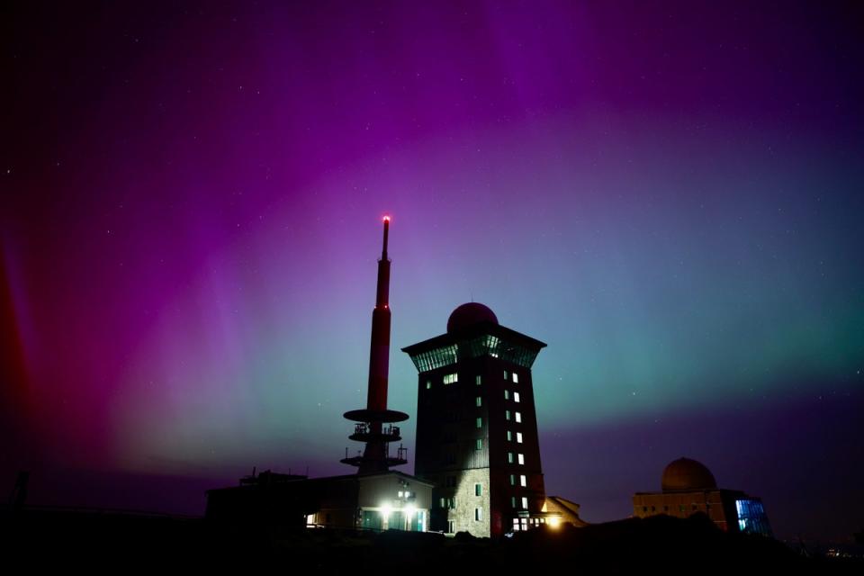 Northern lights appear in the night sky above the Brocken peak in northern Germany early on Saturday (DPA)