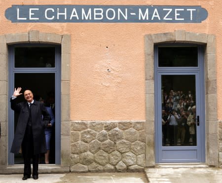 FILE PHOTO: File photo of French President Jacques Chirac waves on arrival at the Chambon-Mazet railway station during a visit to the French provinces