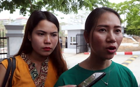 Pan Ei Mon, right, wife of Reuters journalist Wa Lone, talks to journalists as she leaves the Supreme Court along with Chit Su Win, left, wife of Reuters journalist Kyaw Soe Oo - Credit: AP