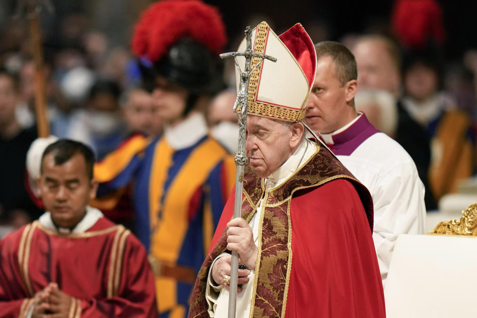 Pope Francis holds the crucifix as he celebrates a Mass on the Solemnity of Saints Peter and Paul, in St. Peter's Basilica at the Vatican, Wednesday, June 29, 2022. (AP Photo/Alessandra Tarantino)