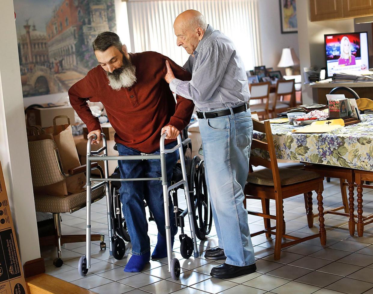 Ninety-five-year-old Carmine "Charlie" Mazzulli, right, is a hero to his son Bob, 53.