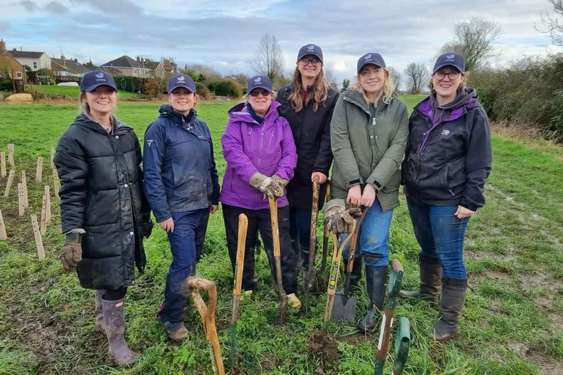 Staff from Durham water retailer Wave take part in a tree planting event