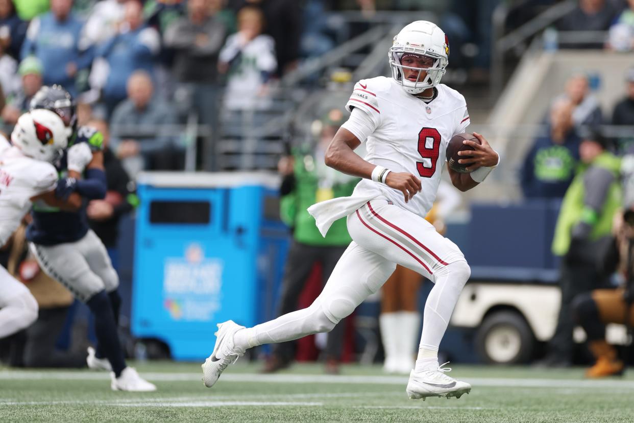 SEATTLE, WASHINGTON - OCTOBER 22: Joshua Dobbs #9 of the Arizona Cardinals carries the ball to score a touchdown in the second quarter of the game against the Seattle Seahawks at Lumen Field on October 22, 2023 in Seattle, Washington. (Photo by Steph Chambers/Getty Images)