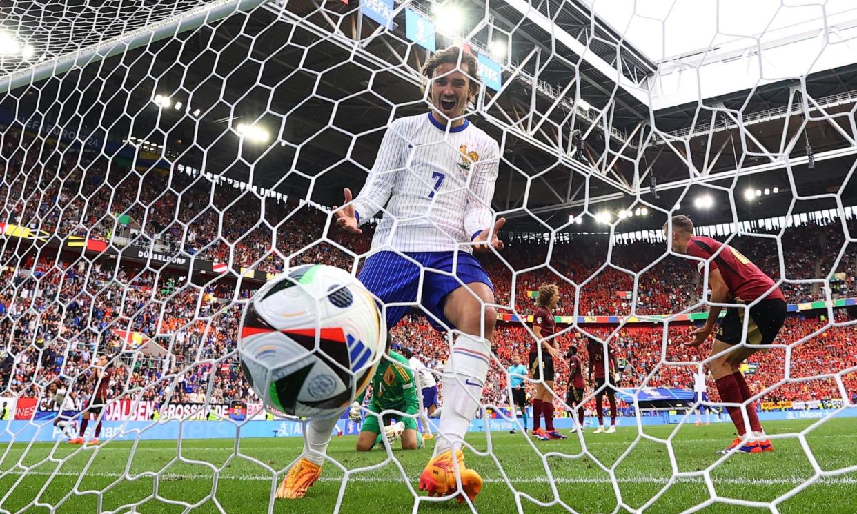 <span>Antoine Griezmann celebrates as an own goal puts France ahead against Belgium.</span><span>Photograph: Bernadett Szabo/Reuters</span>